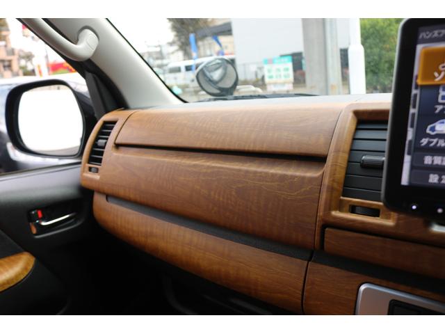 ハイエースバン ロングスーパーＧＬ　丸目フェイスツートンカラーＤＥＡＮ１６インチアルミクラシックオーバルタイヤＢＩＧ－ＸナビＥＴＣフリップダウンモニターメティオサウンドＦＬＥＸシートカバーベッドキット黄木目インテリアパネルステアリング（24枚目）