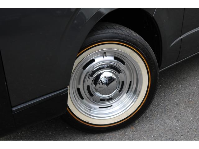 ハイエースバン ロングスーパーＧＬ　丸目フェイスツートンカラーＤＥＡＮ１６インチアルミクラシックオーバルタイヤＢＩＧ－ＸナビＥＴＣフリップダウンモニターメティオサウンドＦＬＥＸシートカバーベッドキット黄木目インテリアパネルステアリング（49枚目）
