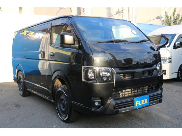 ハイエースバン スーパーＧＬ　ダークプライムＩＩ　カロッツェリアディスプレイオーディオＥＴＣ２．０フリップダウンモニタールーフスピーカーＦＬＥＸ１６インチアルミダンロップタイヤＴ－ＦｏｒｃｅスポイラーＦＬＥＸＬＥＤテールメッキ部マッドブラック塗装（10枚目）