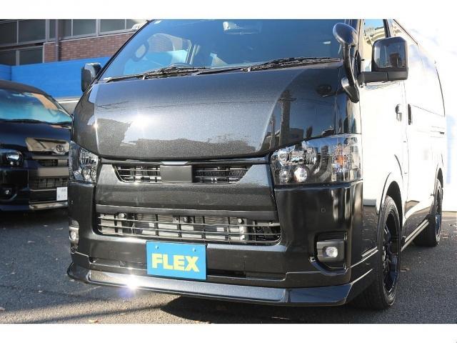 ハイエースバン スーパーＧＬ　ダークプライムＩＩ　アルパイン　ＢＩＧ－Ｘ１１インチナビメカレスＥＴＣ２．０ベッドキットＦＬＥＸボンネットフロントスポイラーオーバーフェンダーＬＥＤテールＦＬＥＸ１８インチアルミヨコハマタイヤメッキ部ブラック塗装（4枚目）