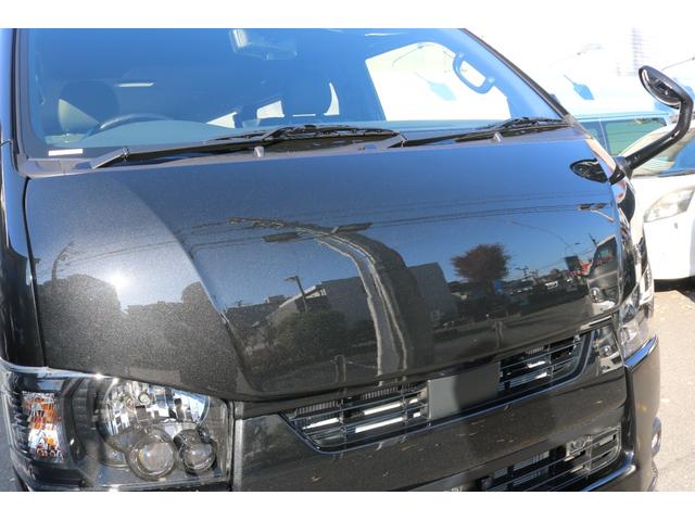 ハイエースバン スーパーＧＬ　ダークプライムＩＩ　アルパイン　ＢＩＧ－Ｘ１１インチナビメカレスＥＴＣ２．０ベッドキットＦＬＥＸボンネットフロントスポイラーオーバーフェンダーＬＥＤテールＦＬＥＸ１８インチアルミヨコハマタイヤメッキ部ブラック塗装（5枚目）