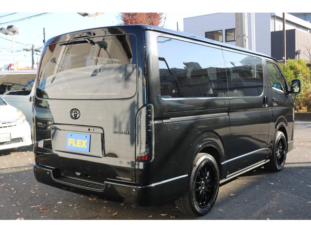ハイエースバン スーパーＧＬ　ダークプライムＩＩ　アルパイン　ＢＩＧ－Ｘ１１インチナビメカレスＥＴＣ２．０ベッドキットＦＬＥＸボンネットフロントスポイラーオーバーフェンダーＬＥＤテールＦＬＥＸ１８インチアルミヨコハマタイヤメッキ部ブラック塗装（10枚目）