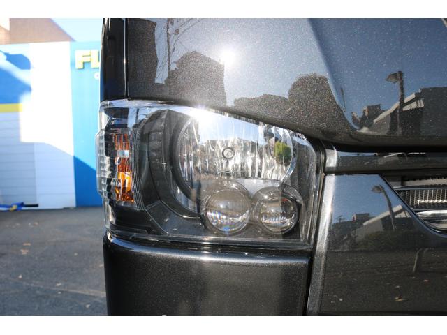 ハイエースバン スーパーＧＬ　ダークプライムＩＩ　アルパイン　ＢＩＧ－Ｘ１１インチナビメカレスＥＴＣ２．０ベッドキットＦＬＥＸボンネットフロントスポイラーオーバーフェンダーＬＥＤテールＦＬＥＸ１８インチアルミヨコハマタイヤメッキ部ブラック塗装（23枚目）