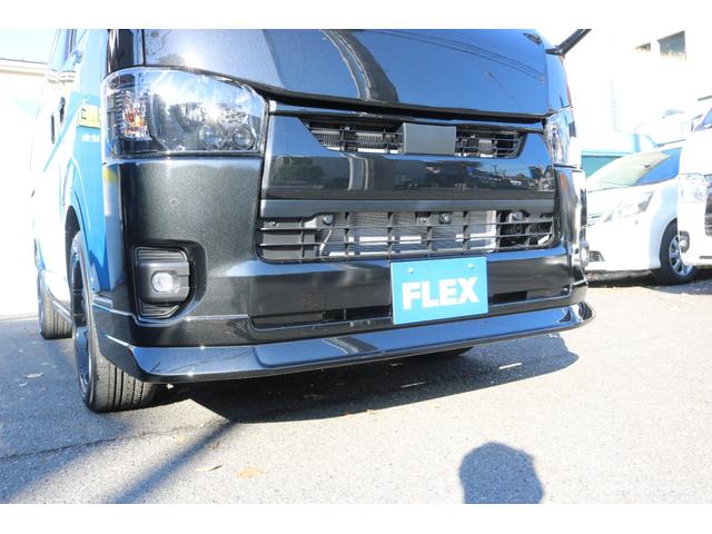 ハイエースバン スーパーＧＬ　ダークプライムＩＩ　アルパイン　ＢＩＧ－Ｘ１１インチナビメカレスＥＴＣ２．０ベッドキットＦＬＥＸボンネットフロントスポイラーオーバーフェンダーＬＥＤテールＦＬＥＸ１８インチアルミヨコハマタイヤメッキ部ブラック塗装（25枚目）