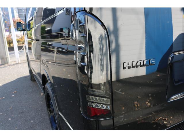 ハイエースバン スーパーＧＬ　ダークプライムＩＩ　アルパイン　ＢＩＧ－Ｘ１１インチナビメカレスＥＴＣ２．０ベッドキットＦＬＥＸボンネットフロントスポイラーオーバーフェンダーＬＥＤテールＦＬＥＸ１８インチアルミヨコハマタイヤメッキ部ブラック塗装（29枚目）