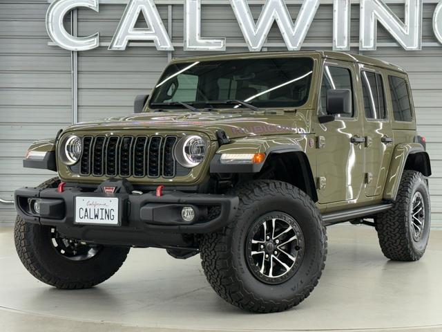 ジープ・ラングラーアンリミテッド ルビコンＸ　３．６Ｌ　新色４１　日本未発売グレード　スカイトップ　エクストリームリーコン３５タイヤＰＫＧ　フロント１２ｗａｙパワーシート　３５インチタイヤ　ブラックナッパレザーシート　１２．３インチモニター　ワイヤレスアップルカープレイ　シートヒーター（6枚目）