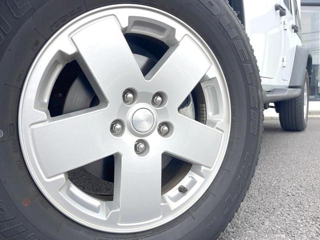 ジープ・ラングラーアンリミテッド スポーツ　Ｐａｎａｓｏｎｉｃ製９型ナビ　ＬＥＤヘッドランプ　フルセグＴＶ　リアビューカメラ　サイドカメラ　オートクルーズコントロール　純正１８インチアルミホイール　革巻きステアリングホイール　ＥＴＣ　禁煙車（14枚目）