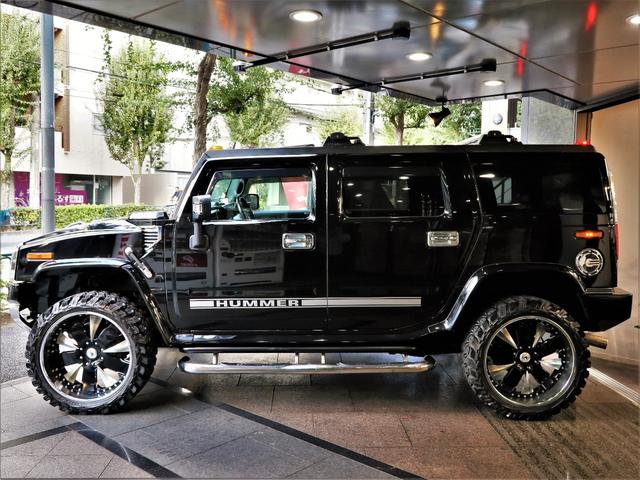 ディーラー車・24AW・新品MTタイヤ・ギブソン左右マフラー ・ASANTI・超ワイドスペーサ-・前後クロ-ムバンパ-・サイドデカール・アルカンタラ張替・カスタム音響・前席Wモニタ-・後席モニター3発・特注グラフィックパネル・ブルガリ・サンルーフ・黒革・記録簿有(35枚目)