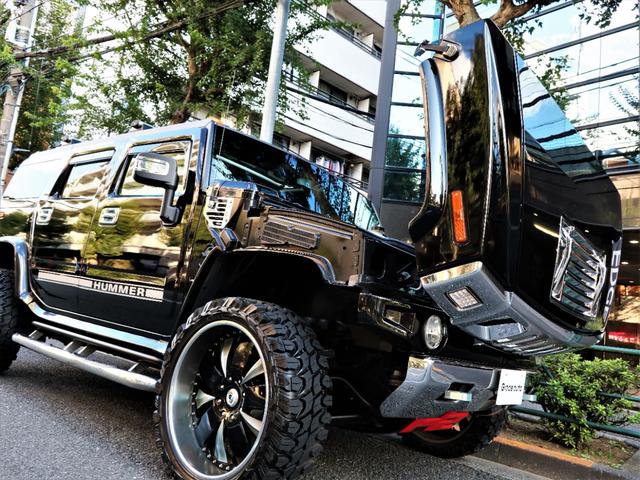 ディーラー車・24AW・新品MTタイヤ・ギブソン左右マフラー ・ASANTI・超ワイドスペーサ-・前後クロ-ムバンパ-・サイドデカール・アルカンタラ張替・カスタム音響・前席Wモニタ-・後席モニター3発・特注グラフィックパネル・ブルガリ・サンルーフ・黒革・記録簿有(77枚目)