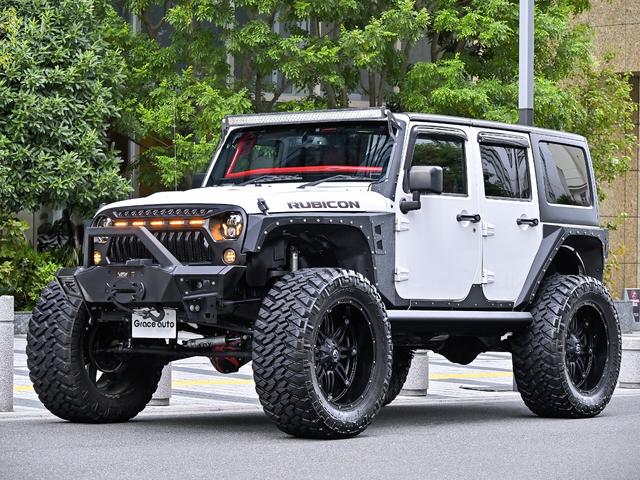 ジープ・ラングラーアンリミテッド ルビコン・ハードロック・フルカスタム・新品電動サイドステップ ・リフトUP・FUEL24in・金属製アーマーフェンダー・社外バンパー・社外グリル・LEDライト・マグナフロー2本出しマフラー・FOX足廻り・社外デフカバー・社外ロールケージ・LEDアンビエントライト(3枚目)