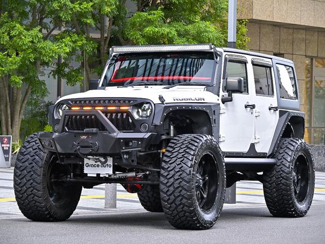 ジープ・ラングラーアンリミテッド ルビコン・ハードロック・フルカスタム・新品電動サイドステップ ・リフトUP・FUEL24in・金属製アーマーフェンダー・社外バンパー・社外グリル・LEDライト・マグナフロー2本出しマフラー・FOX足廻り・社外デフカバー・社外ロールケージ・LEDアンビエントライト(26枚目)