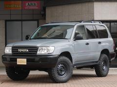 トヨタ　ランドクルーザー１００　ＶＸ　ＮＥＷオールペイント：セメントグレー　ＴＯＹＯＴＡロゴグリル　ＢＦグッドリッチＡＴ×Ｄ：ＳＬＯＴ１６インチＡＷ