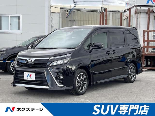 沖縄県豊見城市の中古車ならヴォクシー ＺＳ　フリップダウンモニター　衝突軽減装置　禁煙車　電動スライドドア　９インチ純正ナビ　バックカメラ　Ｂｌｕｅｔｏｏｔｈ再生　フルセグＴＶ　ＥＴＣ　ＬＥＤヘッドライト　クルーズコントロール