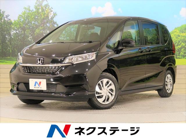 ホンダ フリードｇ ホンダセンシング 登録済み未使用車 ホンダセンシング 両側電動ドア レーダークルーズ レーンアシスト スマートキー ｅｔｃ バックカメラ アイドリングストップ オートエアコン ７人乗り 禁煙車の中古車 21 令和3 年式 走行6キロ 車体色クリスタル
