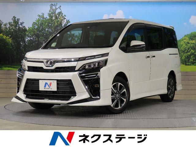 トヨタ ヴォクシーｚｓ 禁煙車 ７人乗り ムーンルーフ メーカーナビ 両側電動ドア ｔｒｄエアロ セーフティセンス ｌｅｄヘッド クルーズコントロール クリアランスソナー ｅｔｃ２ ０の中古車 車体価格309 9万円 19 令和1 年式 走行0 6万キロ 車体色ホワイトパール