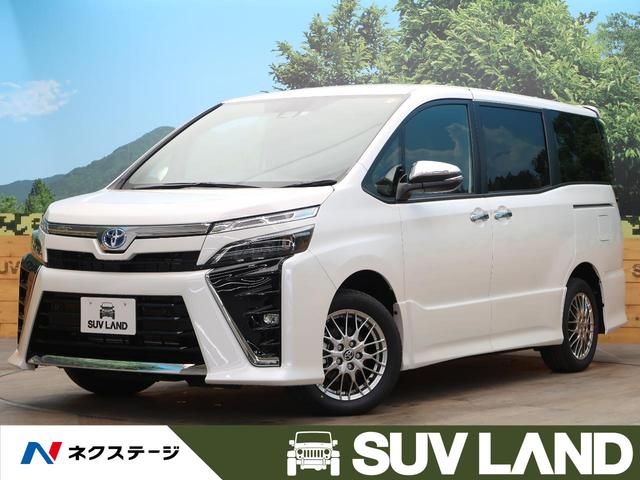 ヴォクシー トヨタ ハイブリッドｚｓ 煌ｉｉｉ 登録済未使用車 ７人乗 セーフティセンス レーダークルーズ 両側電動ドア ハーフレザー シートヒーター コーナーセンサー 誤発進抑制機能 クルコン ｌｅｄヘッド オートマチックハイビーム 純正１６ａｗ 鹿児島県