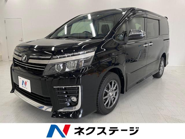 ZS 煌II 4WD 禁煙車 フリップダウンモニター 純正ナビ バックカメラ Bluetooth再生 フルセグTV 両側パワースライドドア 寒冷地仕様 スマートキー ETC 車線逸脱警報 革巻きステアリング(1枚目)