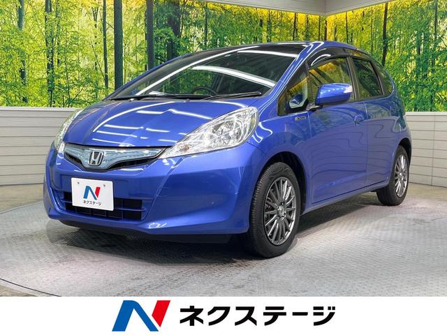 ハイブリッド・10thアニバーサリー 禁煙車 純正SDナビ バックカメラ ETC クルーズコントロール スマートキー 革巻きステアリング DVD再生 盗難防止装置 プライバシーガラス ベンチシート バニティミラー(1枚目)