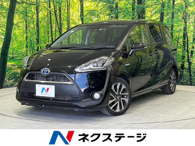 ハイブリッドG クエロ 禁煙車 純正SDナビ フリップダウンモニター 両側電動ドア ハーフレザー LEDヘッド バックカメラ ETC Bluetooth再生 純正16インチアルミ スマートキー 7人乗り(1枚目)