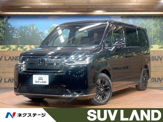 ホンダ ステップワゴン スパーダ　登録済未使用車　両側電動スライドドア　シートヒーター　オットマンシート　ホンダセンシング　レーダークルーズ　パワーバックドア　パドルシフト　ＬＥＤヘッドライト　純正１６インチＡＷ　スマートキー