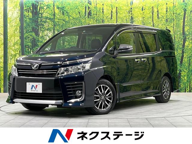 トヨタ ヴォクシー ＺＳ　煌　ＡＬＰＩＮＥナビ　フリップダウンモニター　両側電動スライドドア　バックカメラ　ＥＴＣ　レザー調シートカバー　ＨＩＤヘッドライト　スマートキー　８人乗　ロールサンシェード　革巻きステアリング