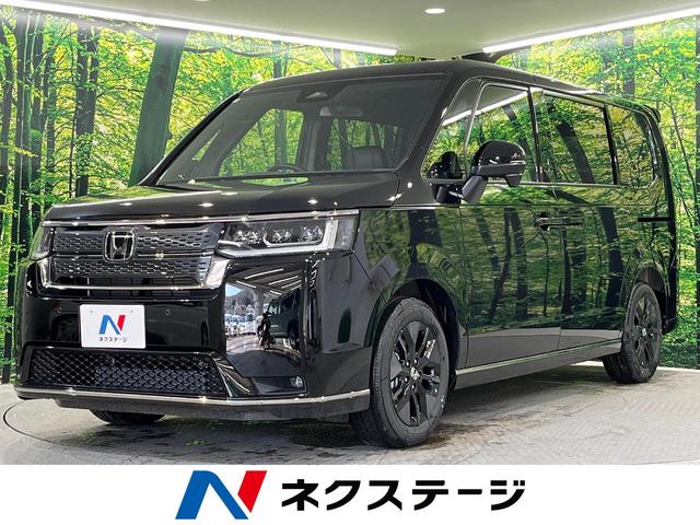 ホンダ ステップワゴン スパーダ　ホンダセンシング　両側電動スライドドア　登録済未使用車　アダプティブクルーズ　バックカメラ　シートヒーター　ハーフレザーシート　ＬＥＤライト　パワーバックドア　クリアランスソナー　ブラインドスポット