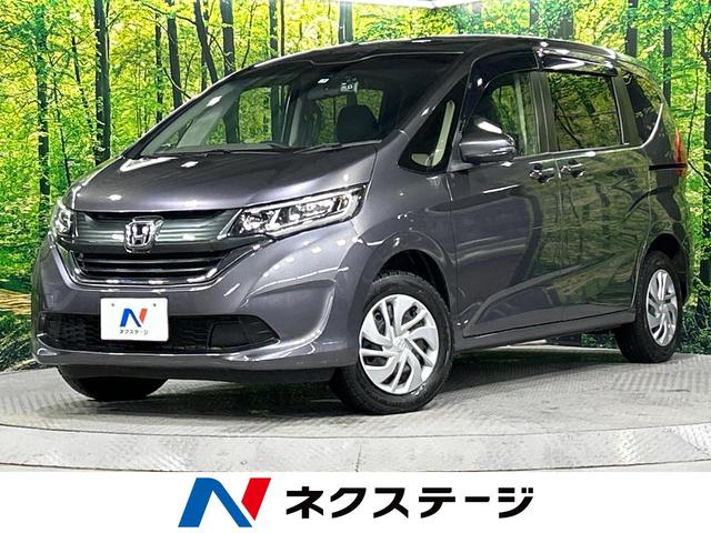 フリード Ｇ・ホンダセンシング　４ＷＤ　禁煙車　純正ナビ　バックカメラ　Ｂｌｕｅｔｏｏｔｈ接続　寒冷地仕様　衝突被害軽減ブレーキ　車線逸脱警報　レーダークルーズコントロール　両側パワースライドドア　ビルトインＥＴＣ（1枚目）