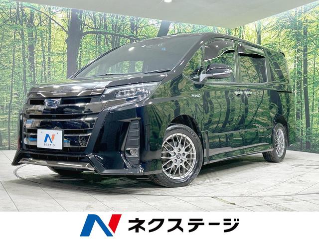 トヨタ ノア ハイブリッドＳｉ　ダブルバイビー　禁煙車　純正９インチナビ　セーフティセンス　両側電動ドア　寒冷地仕様　バックカメラ　Ｂｌｕｅｔｏｏｔｈ再生　フルセグ　シートヒーター　ＥＴＣ　ドラレコ　ＬＥＤヘッド　ハーフレザーシート　車線逸脱警報