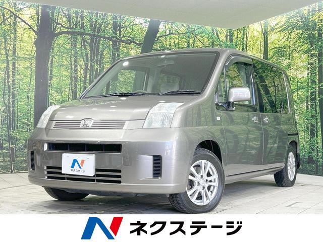 ホンダ モビリオ Ｗ　禁煙車　両側電動ドア　純正ナビ　バックカメラ　ＥＴＣ　オートエアコン　ステアリングスイッチ　盗難防止システム　横滑り防止装置　パワーステアリング　パワーウィンドウ　ヘッドライトレベライザー