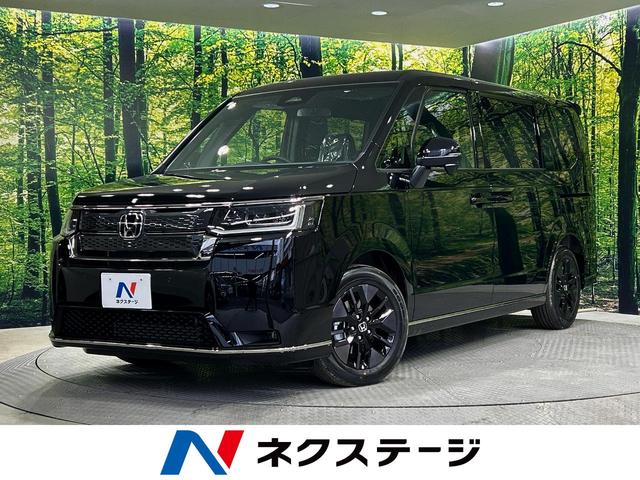 ステップワゴン(ホンダ) スパーダ　登録済未使用車　現行　ホンダセンシング　両側電動ドア　電動リアゲート　合皮コンビシート 中古車画像