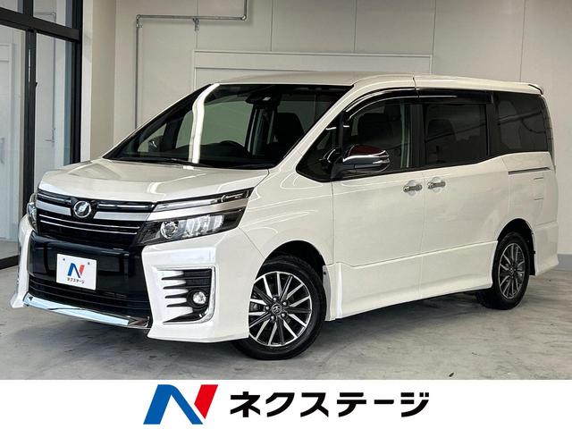 沖縄県の中古車ならヴォクシー ＺＳ　煌ＩＩ　トヨタセーフティセンス　ＳＤナビ　バックカメラ両側電動スライドドア　Ｂｌｕｅｔｏｏｔｈ再生　フルセグＴＶ　ＥＴＣ　ＬＥＤヘッドライト　ＬＥＤフォグ　ドライブレコーダー　７人乗り　スマートキー