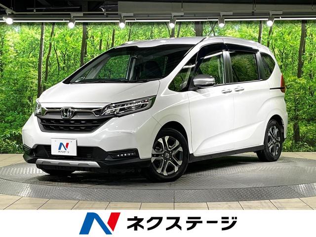 ホンダ フリード クロスター・ホンダセンシング　禁煙車　ホンダセンシング　純正アルミ　ＬＥＤヘッドライト　純正ナビ　両側電動スライドドア　レーダークルーズコントロール　バックカメラ　ハーフレザーシート　スマートキーステアリングスイッチ　ＥＴＣ