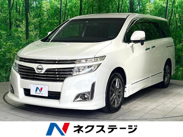 日産 エルグランド ２５０ハイウェイスターアーバンクロム　禁煙車　後席モニター　両側電動スライドドア　ＨＤＤ８型ナビ　バックカメラ　フルセグ　Ｂｌｕｅｔｏｏｔｈ再生　ＥＴＣ　リアオートエアコン　ハーフレザーシート　ＨＩＤヘットライト　ロールサンシェード