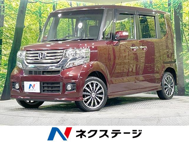 ホンダ Ｎ－ＢＯＸカスタム Ｇ　ターボＳＳパッケージ　４ＷＤ　禁煙車　ターボ　純正ナビ　バックカメラ　両側パワースライドドア　クルーズコントロール　ＨＩＤヘッドライト　純正１５インチアルミホイール　パドルシフト　オートエアコン　Ｈｏｎｄａスマートキー