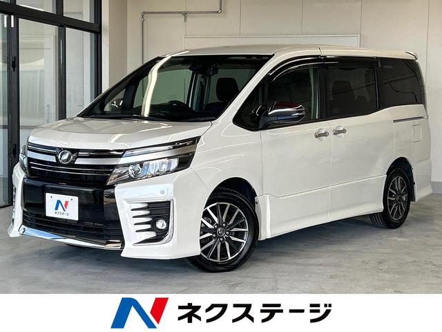 沖縄県の中古車ならヴォクシー ＺＳ　煌ＩＩ　純正ナビ　衝突軽減　両側電動ドア　バックカメラ　フルセグＴＶ　Ｂｌｕｅｔｏｏｔｈ再生　ＥＴＣ　ＬＥＤヘッド＆ＬＥＤフォグ　ドラレコ　スマートキー　レーンキープアシスト　オートライト　車線逸脱警報