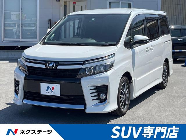 沖縄県豊見城市の中古車ならヴォクシー ＺＳ　禁煙車　純正９インチナビ　バックカメラ　衝突軽減装置　両側パワースライドドア　フルセグ　Ｂｌｕｅｔｏｏｔｈ再生　ＥＴＣ　ＬＥＤヘッドライト　アイドリングストップ　革巻きステアリングホイール