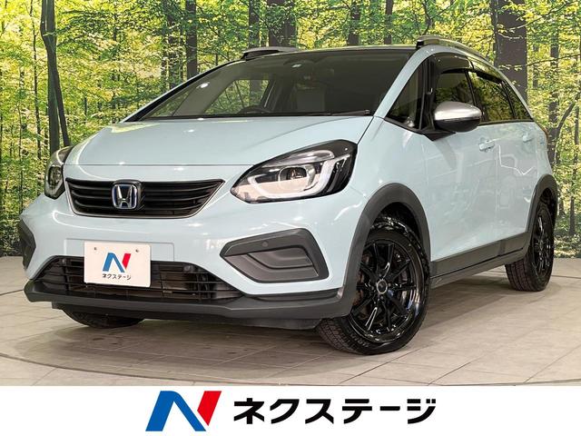 ホンダ フィット ｅ：ＨＥＶクロスター　４ＷＤ　禁煙車　ホンダセンシング　純正９型ナビ　寒冷地仕様　アダプティブクルーズ　バックカメラ　Ｂｌｕｅｔｏｏｔｈ　ＬＥＤヘッド　レーンアシスト　クリアランスソナー　スマートキー　ステアリングリモコン