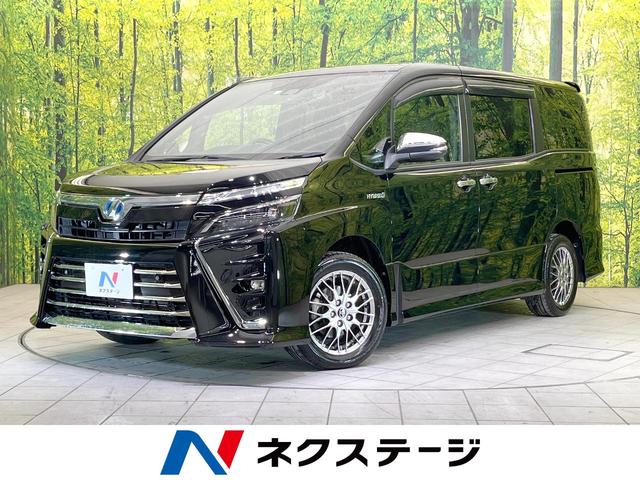 トヨタ ヴォクシー ハイブリッドＺＳ　煌ＩＩ　純正１０型ナビ　後席モニター　両側パワースライドドア　バックカメラ　Ｂｌｕｅｔｏｏｔｈ再生　ドラレコ　フルセグＴＶ　純正１６インチアルミ　ＬＥＤヘッド　ＬＥＤフォグ　スマートキー　前席シートヒーター