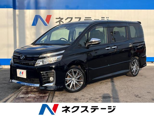 沖縄県の中古車ならヴォクシー ＺＳ　煌　禁煙車　フリップダウンモニター　純正９インチナビ　バックカメラ　両側パワースライドドア　トヨタセーフティーセンス　アダプティブハイビーム　車線逸脱警告装置　スマートキー　アイドリングストップ