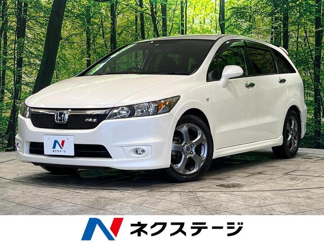 ホンダ ストリーム ＲＳＺ　禁煙車　メーカーナビ　バックカメラ　ＥＴＣ　ＨＩＤヘッド　７人乗り　オートライト　オートエアコン　キーレスエントリー　フロントフォグ　純正１７インチアルミホイール　パドルシフト　革巻きステアリング