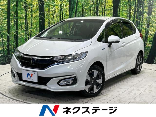 ホンダ フィットハイブリッド Ｌ　ホンダセンシング　純正ＳＤナビ　ホンダセンシング　バックカメラ　フルセグＴＶ　ｂｌｕｅｔｏｏｔｈ　レーダークルーズ　車線逸脱警報　ＬＥＤヘッド・フォグ　ＥＴＣ　電動格納ミラー　オートエアコン　ステアリングスイッチ