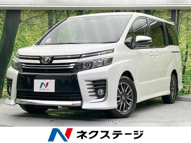 トヨタ ヴォクシー ＺＳ　フリップダウンモニター　両側電動スライドドア　禁煙車　純正ナビ　バックカメラ　Ｂｌｕｅｔｏｏｔｈ再生　ＥＴＣ　ＬＥＤヘッドライト　革巻きステアリング　ステアリングスイッチ　デュアルオートエアコン