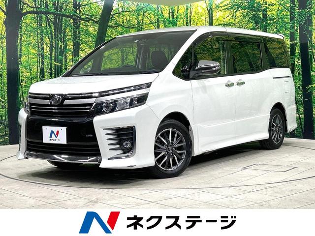 ヴォクシー ＺＳ　煌ＩＩ　両側電動スライドドア　トヨタセーフティセンス　禁煙車　８型ナビ　バックカメラ　ＥＴＣ　Ｂｌｕｅｔｏｏｔｈ　フルセグ　ＬＥＤヘッドライト　ＬＥＤフォグライト　クリアランスソナー　リアオートエアコン（1枚目）