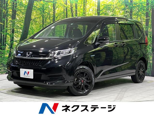 ホンダ フリードハイブリッド ハイブリッド・Ｇホンダセンシング　４ＷＤ　禁煙車　寒冷地仕様　ホンダセンシング　純正ＳＤナビ　両側パワスラ　バックカメラ　シートヒーター　ＬＥＤヘッドライト　ＥＴＣ　１５インチアルミホイール　ステアリングスイッチ　スマートキー