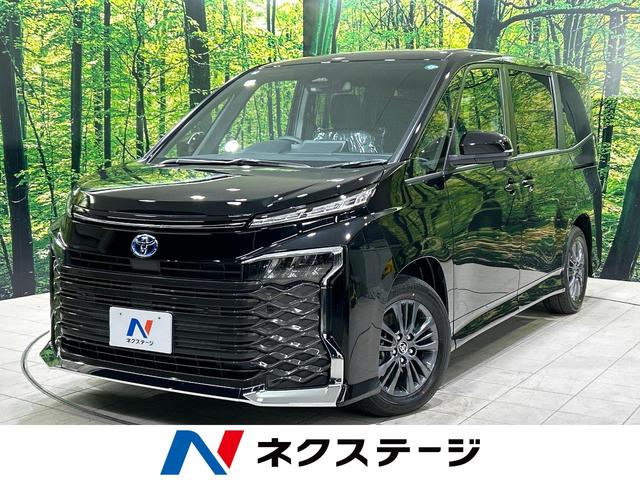 ヴォクシー(トヨタ) ハイブリッドＳ−Ｇ　登録済未使用車　両側パワースライドドア　純正８型ディスプレイオーディオ　レーダークルーズコントロール　７人乗り　ＴＶ＋ＣＤ／ＤＶＤデッキ 中古車画像