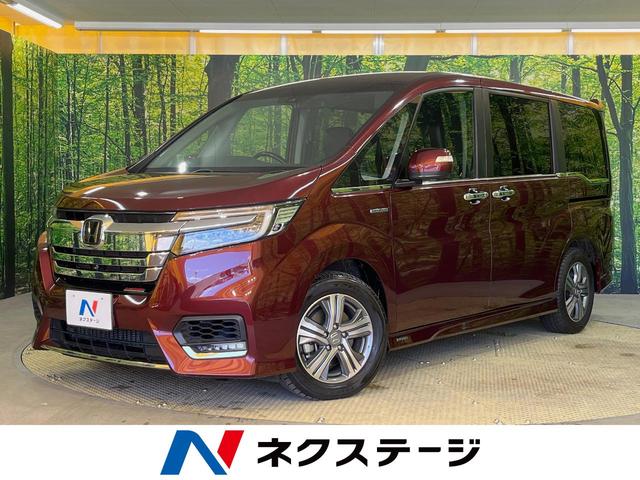 ホンダ ステップワゴンスパーダ スパーダハイブリッド　Ｇ・ＥＸ　ホンダセンシング　衝突被害軽減装置　両側電動スライドドア　純正９型ナビ　リアエンターテイメント　マルチビューカメラ　ＥＴＣ　シートヒーター　合皮コンビシート　ダブルエアコン　純正１６インチアルミ　禁煙車　スマートキー