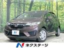 フィット １３Ｇ・Ｆパッケージ　コンフォートエディション　純正ナビ　禁煙車　衝突軽減装置　シートヒーター　ＥＴＣ　オートエアコン　アームレスト　バニティミラー　プライバシーガラス　アイドリングストップ　電動格納ミラー　プッシュスタート　盗難防止装置（1枚目）