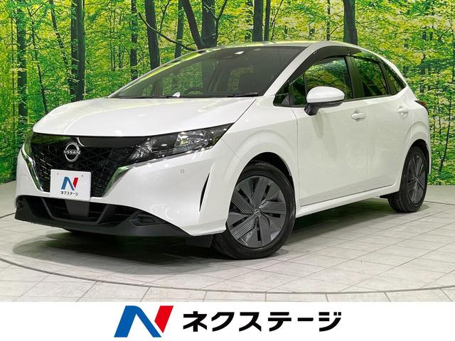 日産 ノート Ｘ　ＦＯＵＲ　４ＷＤ　禁煙車　純正ナビ　　バックカメラ　Ｂｌｕｅｔｏｏｔｈ再生　フルセグＴＶ　ＥＴＣ　シートヒーター　ドライブレコーダー　クリアランスソナー　車線逸脱警報　スマートキー　オートライト　革巻きハンドル