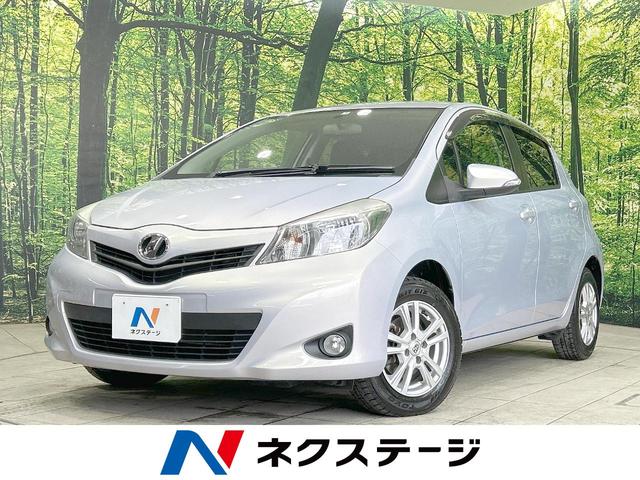 ヴィッツ(トヨタ) Ｆ　スマイルエディション　禁煙車　純正ナビ　バックカメラ　Ｂｌｕｅｔｏｏｔｈ再生　ＥＴＣ 中古車画像