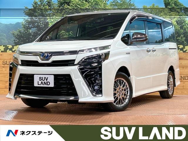 トヨタ ヴォクシー ハイブリッドＺＳ　煌ＩＩ　禁煙車　後席モニター　１０型ナビフルセグ　両側電動ドア　７人乗り　シートヒーター　オートクルーズ　クリアランスソナー　ＬＥＤヘッド　純正１６インチＡＷ　バックカメラ　ＥＴＣ　Ｂｌｕｅｔｏｏｔｈ再生